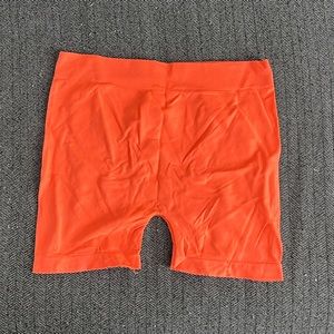 Bright Orange, Spandex shorts.